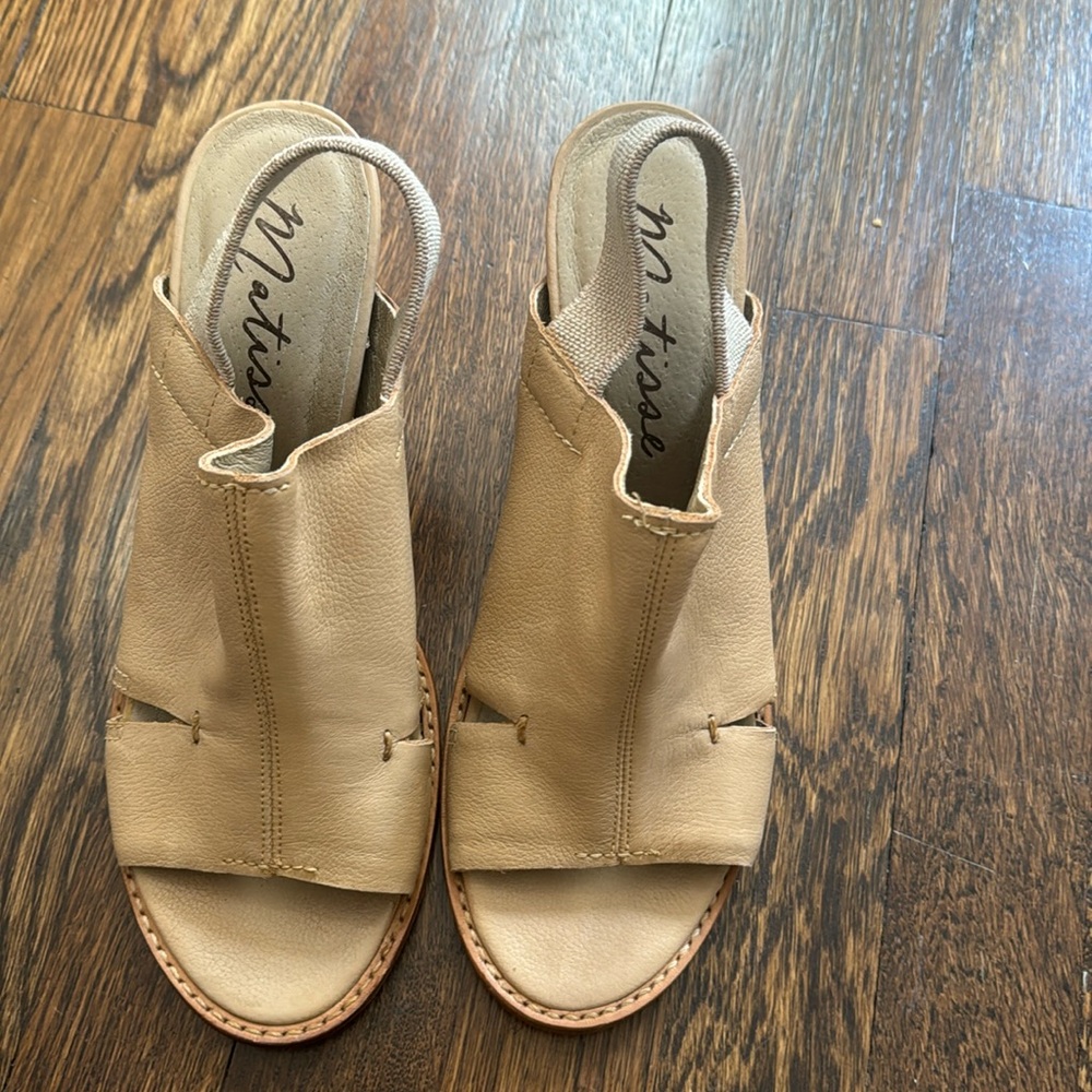 Tan open back shoes with thick elastic. Size 9 made in Brazil.